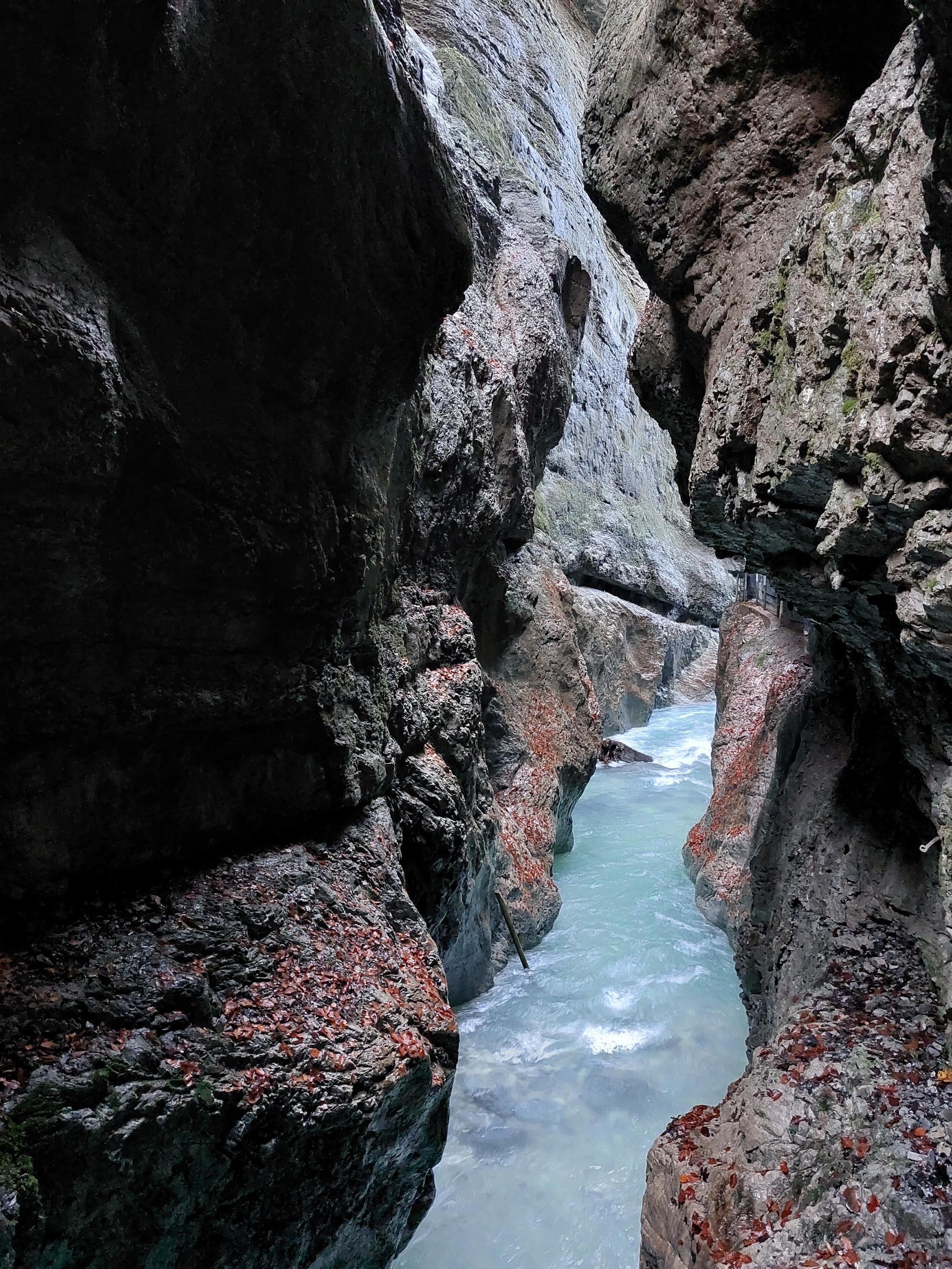Partnach Gorge: A narrow gorge with a rushing blue river. (Shot by my girlfriend.)
AI generated caption: Narrow gorge with flowing turquoise water. Steep rocky walls. Partnach Gorge: A narrow gorge with a rushing blue river. (Shot by my girlfriend.)
AI generated caption: Narrow gorge with flowing turquoise water. Steep rocky walls.