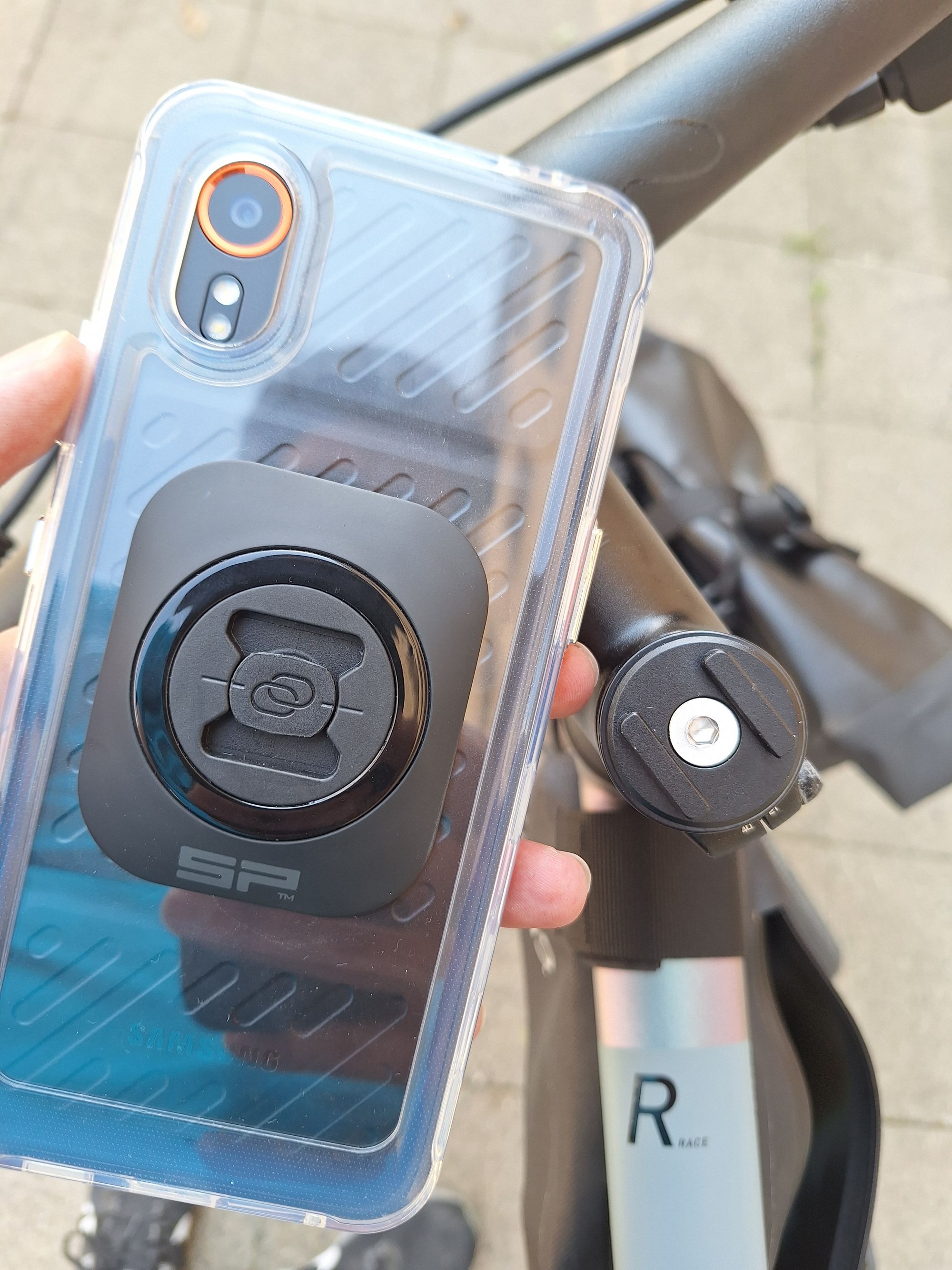 The SP Connect interface on the back of the phone case and the stem mount on the bike. The SP Connect interface on the back of the phone case and the stem mount on the bike.